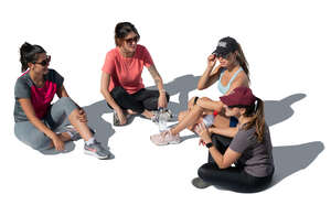 group of women sitting on the ground seen from top angle
