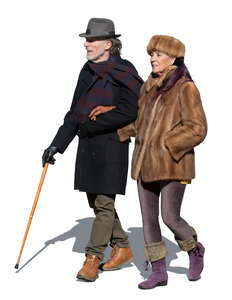 elderly couple walking on a sunny winter day