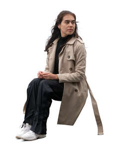 cut out mexican woman with an overcoat sitting