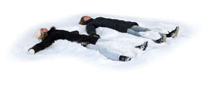 two cut out people lying in the snow making snow angels