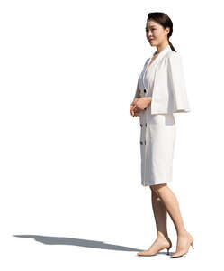 asian woman in a white dress standing