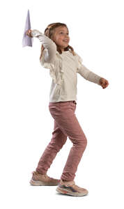 little girl throwing a paper plane