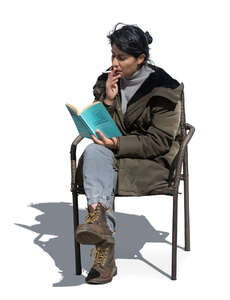 cut out woman sitting and smoking and reading a book