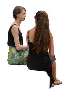 two women sitting and talking