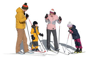 cut out family with kids preparing to go skiing