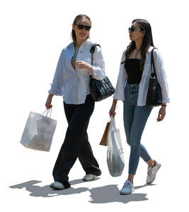 two backlit women coming from shopping