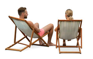 man and woman relaxing in the beach chairs and talking