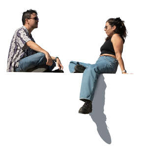 two cut out people sitting seen from below angle