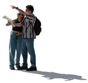 backlit man and woman with a tourist map standing and discussing