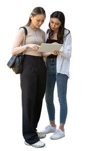 two women with a tablet standing and talking