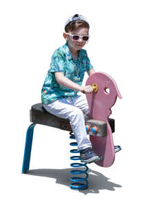 cut out little boy playing on the playground