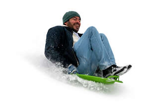 cut out man sledding down the hill