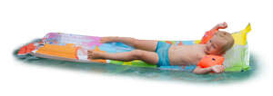 little boy relaxing on an air mattress in a pool