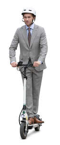 businessman in a grey suit and wearing a helmet riding a scooter