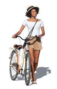 woman with a hat and a bicycle walking