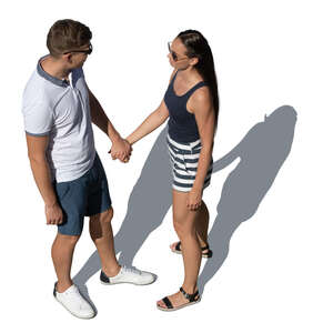 couple holding hands standing and looking at each other seen from above