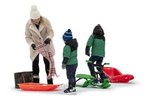 family with two kids going sledging