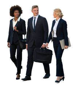 group of three businesspeople walking
