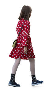 little girl in a dotted dress walking