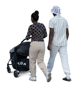 indian couple with a baby stroller walking