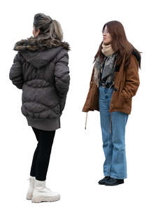 two women wearing winter jackets standing