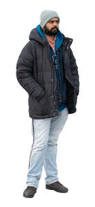 indian man wearing a winter jacket standing
