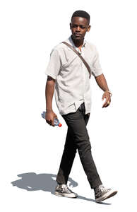 cut out young black man walking in the sunlight