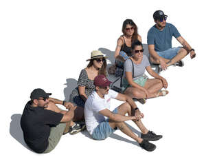 group of friends sitting on the ground seen from above