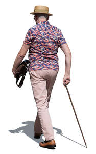 older gentleman with a walking stick walking