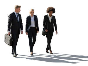 backlit group of office workers walking