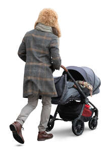 man with a baby stroller walking