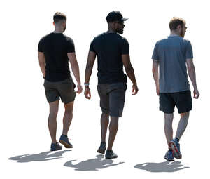 group of backlit men walking