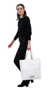 woman with a big white bag walking