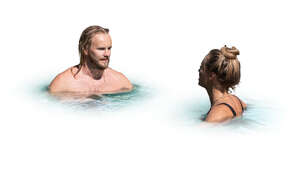 man and woman relaxing in the water