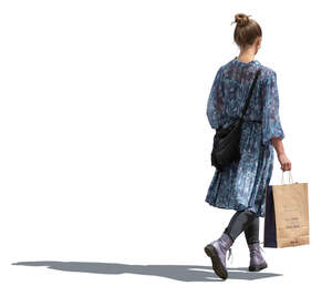 woman in a blue dress walking