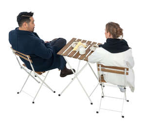 two people sitting in a cafe on a chilly day seen from above