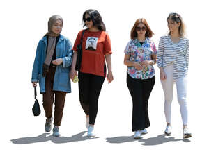 backlit group of four girls walking