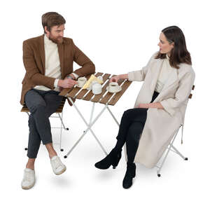 man and woman sitting in a cafe seen from above