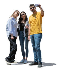 group of friends taking a selfie outside