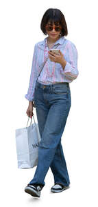 woman with a shopping bag walking
