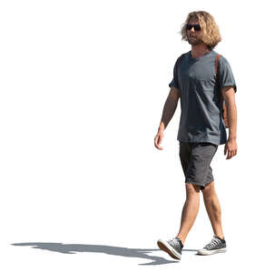 young man in shorts walking
