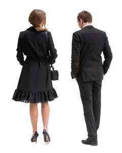 man and woman in formal party clothes walking