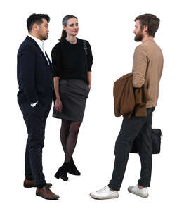 group of three people standing and talking