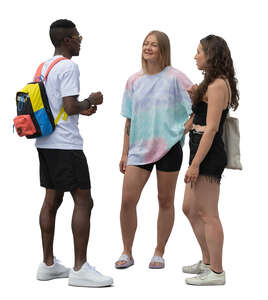 group of three friends standing and talking