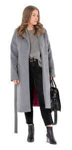 woman wearing a grey overcoat standing