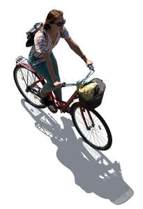 backlit woman cycling seen from top view