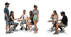 group of people hanging out in an outdoor restaurant