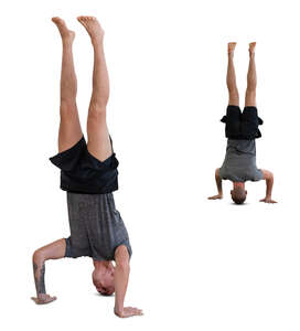 man standing on his head with a mirror reflection