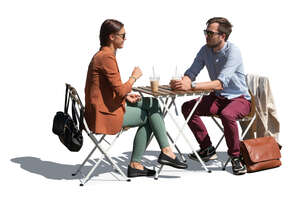 man and woman sitting in a casual outdoor coffeeshop