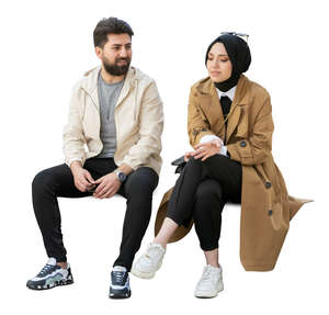 muslim woman and man sitting and talking
